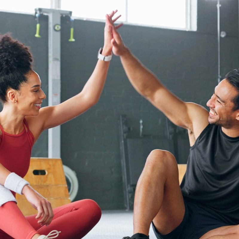 People seated high-fiving